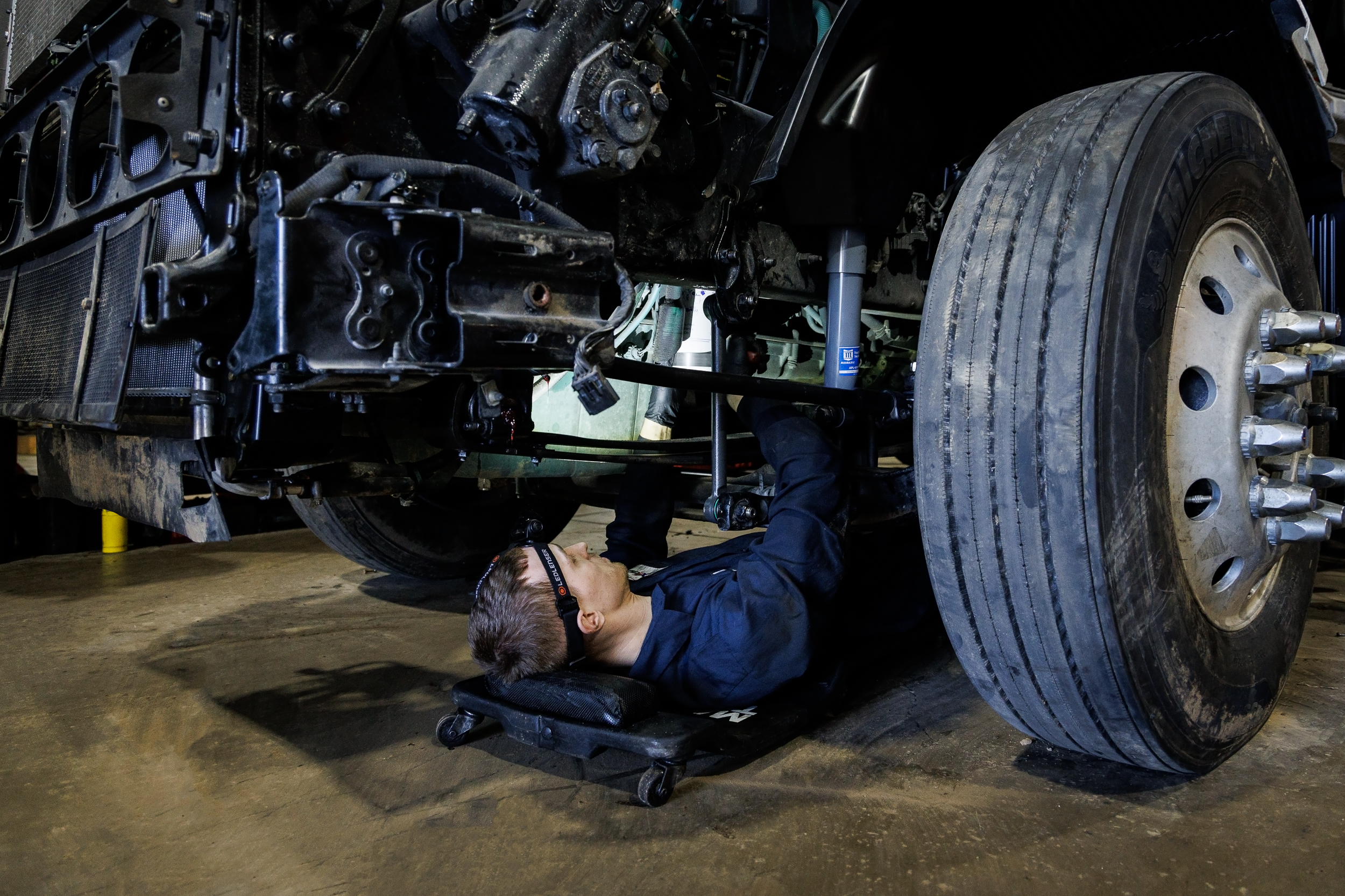 Truck suspension repair by mechanic