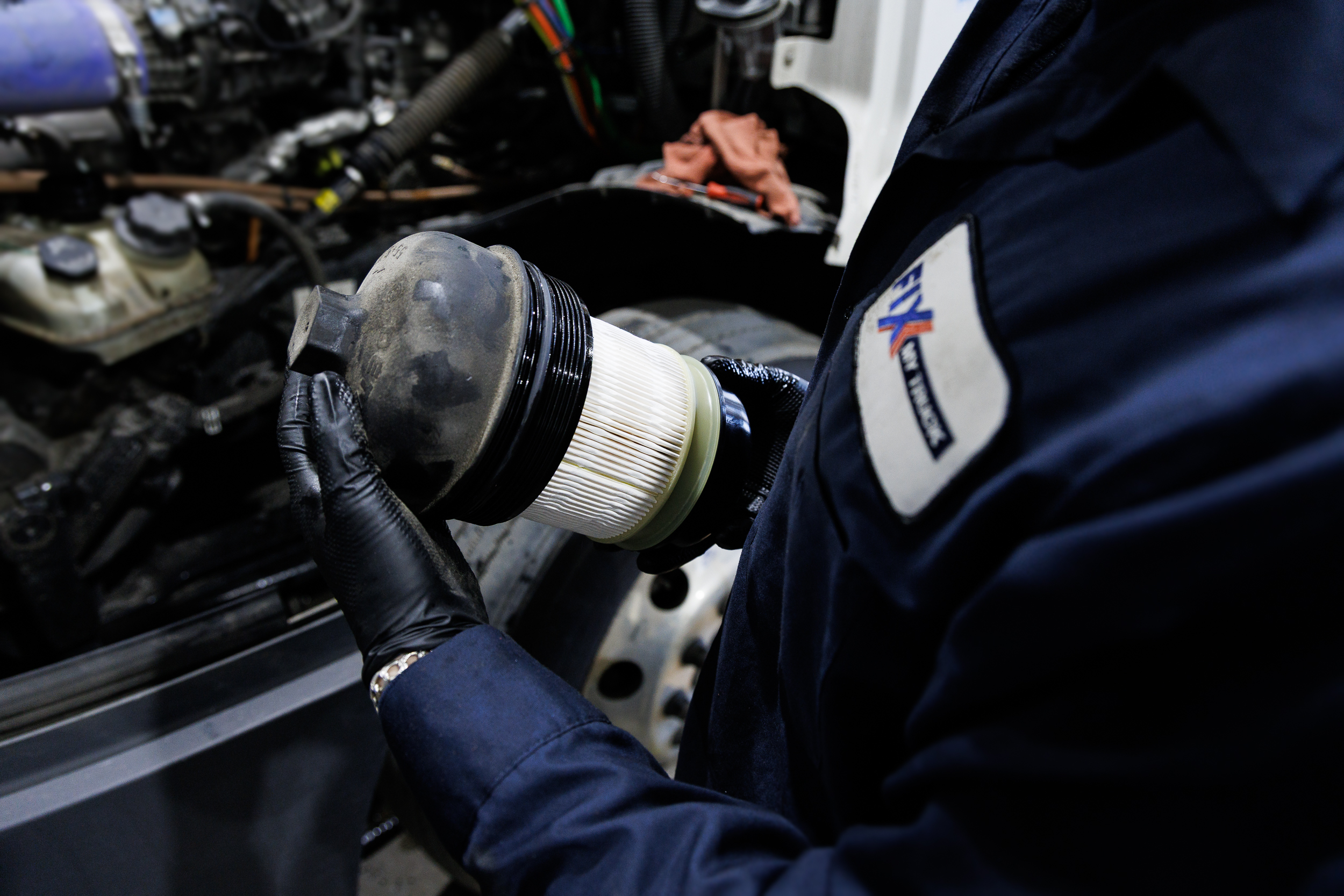 mechanic is checking fuel filter